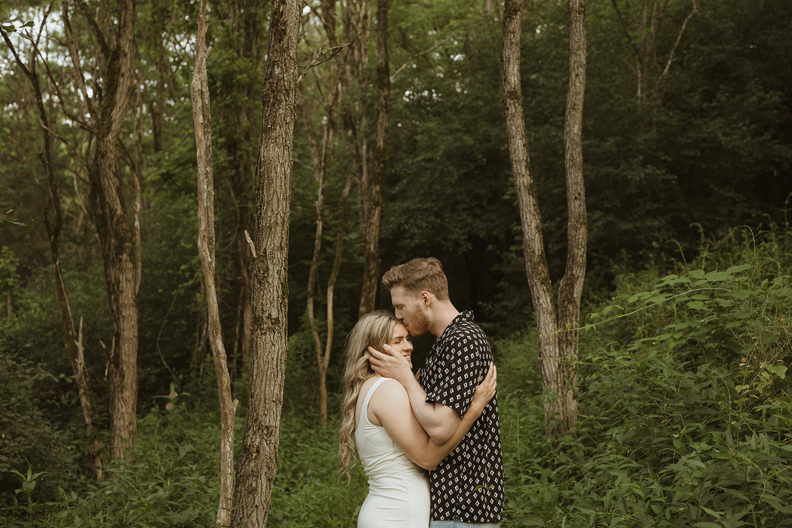 couple kiss at durham region engagement photoshoot location